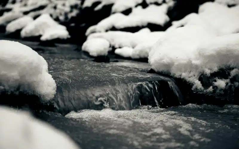mountain stream and snow